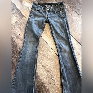 Two pairs of American eagle bootcut jeans